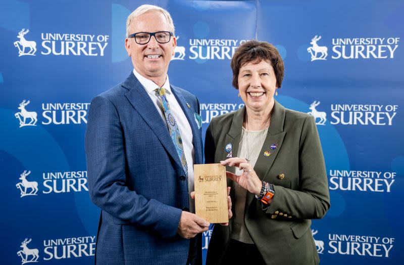 Dr Nicky Fox collects her Vice-Chancellor's Alumni Award from Provost Tim Dunne