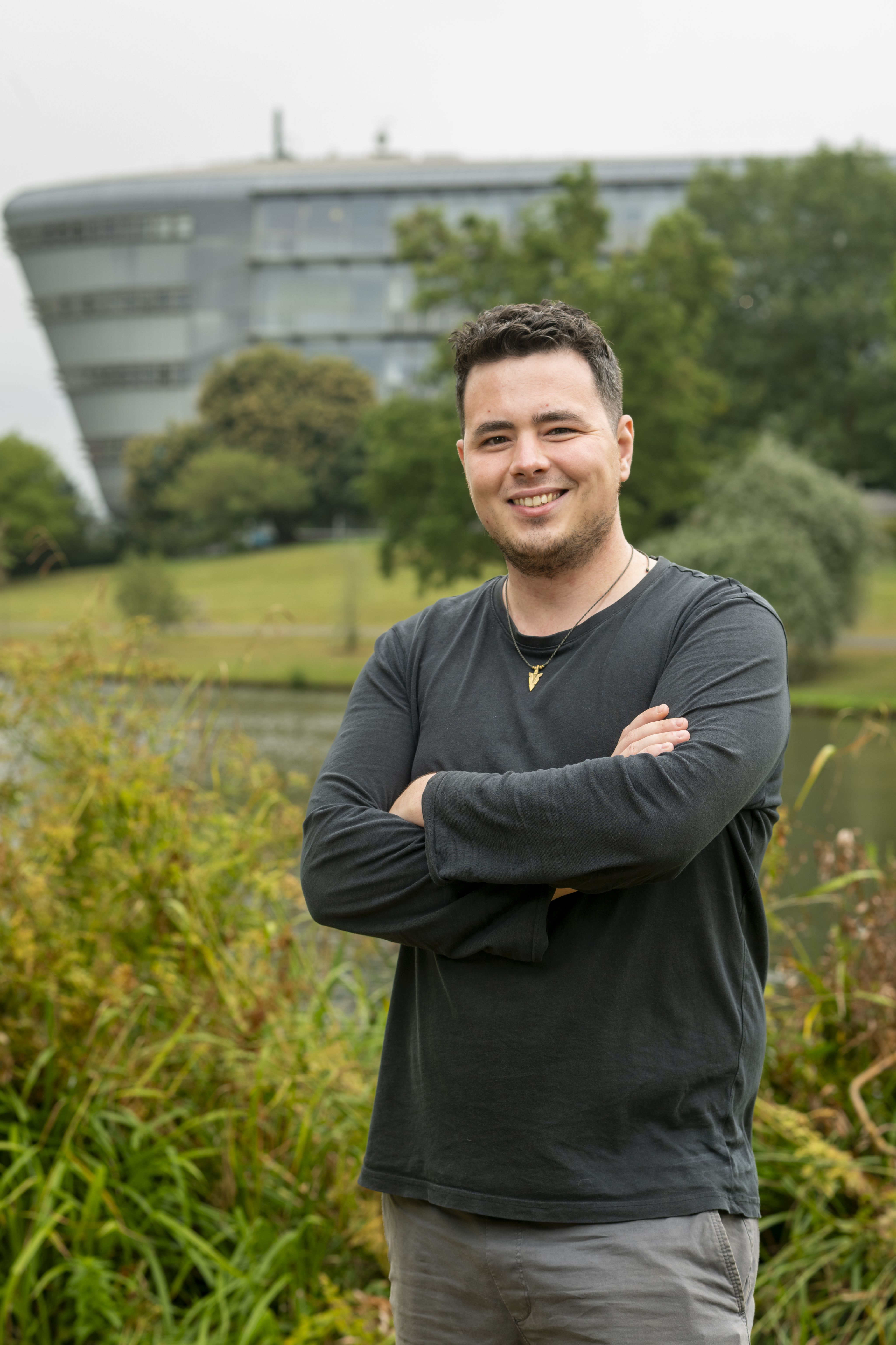 Huw Samuel with the lake and Duke of Kent building behind