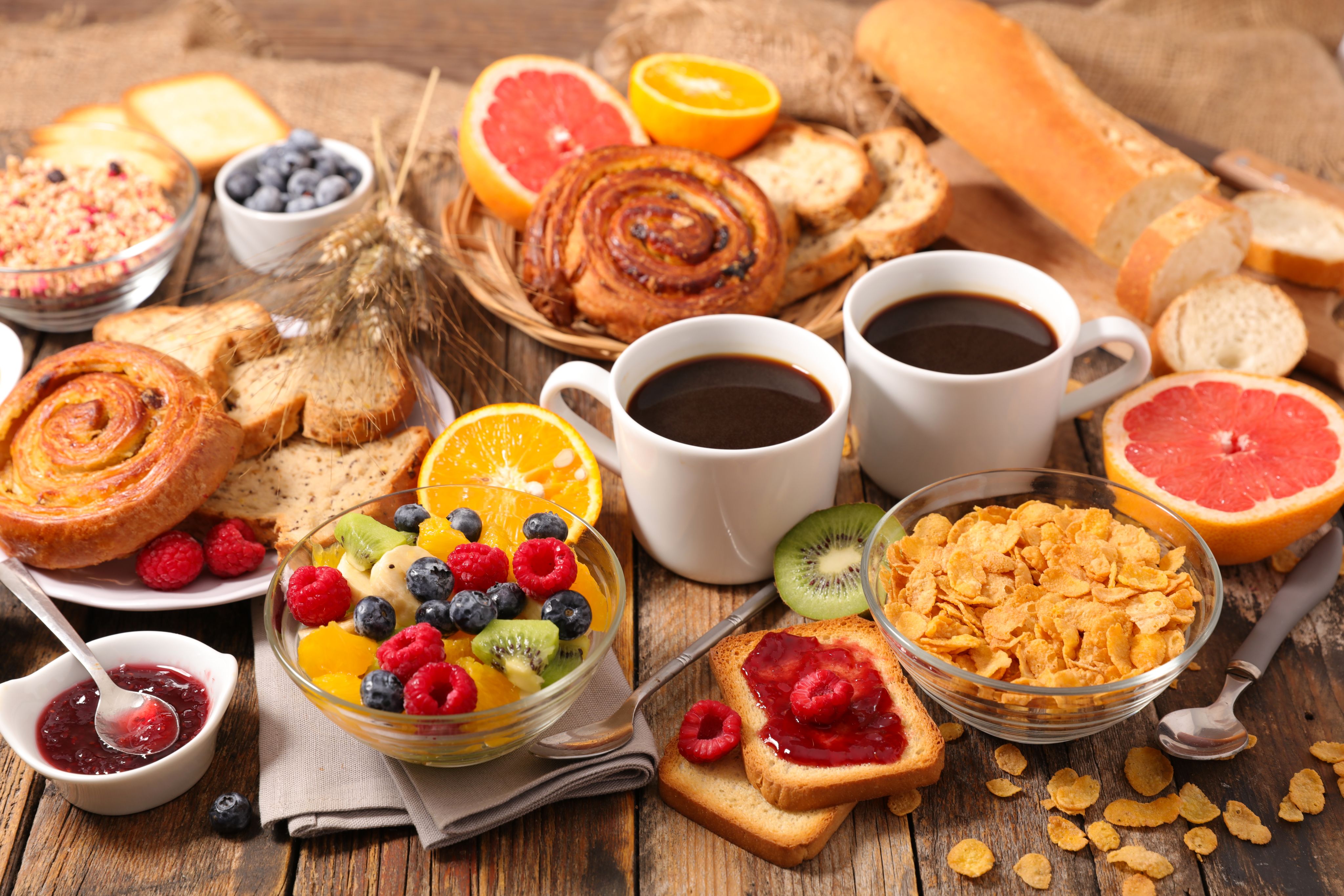 Continental breakfast with coffee, pastries, fruit, cereal and bread