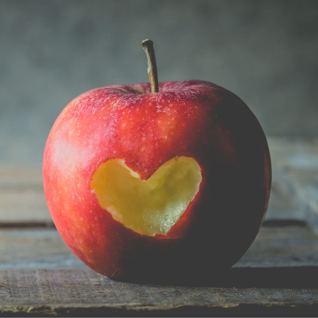 An apple with a heart in the middle