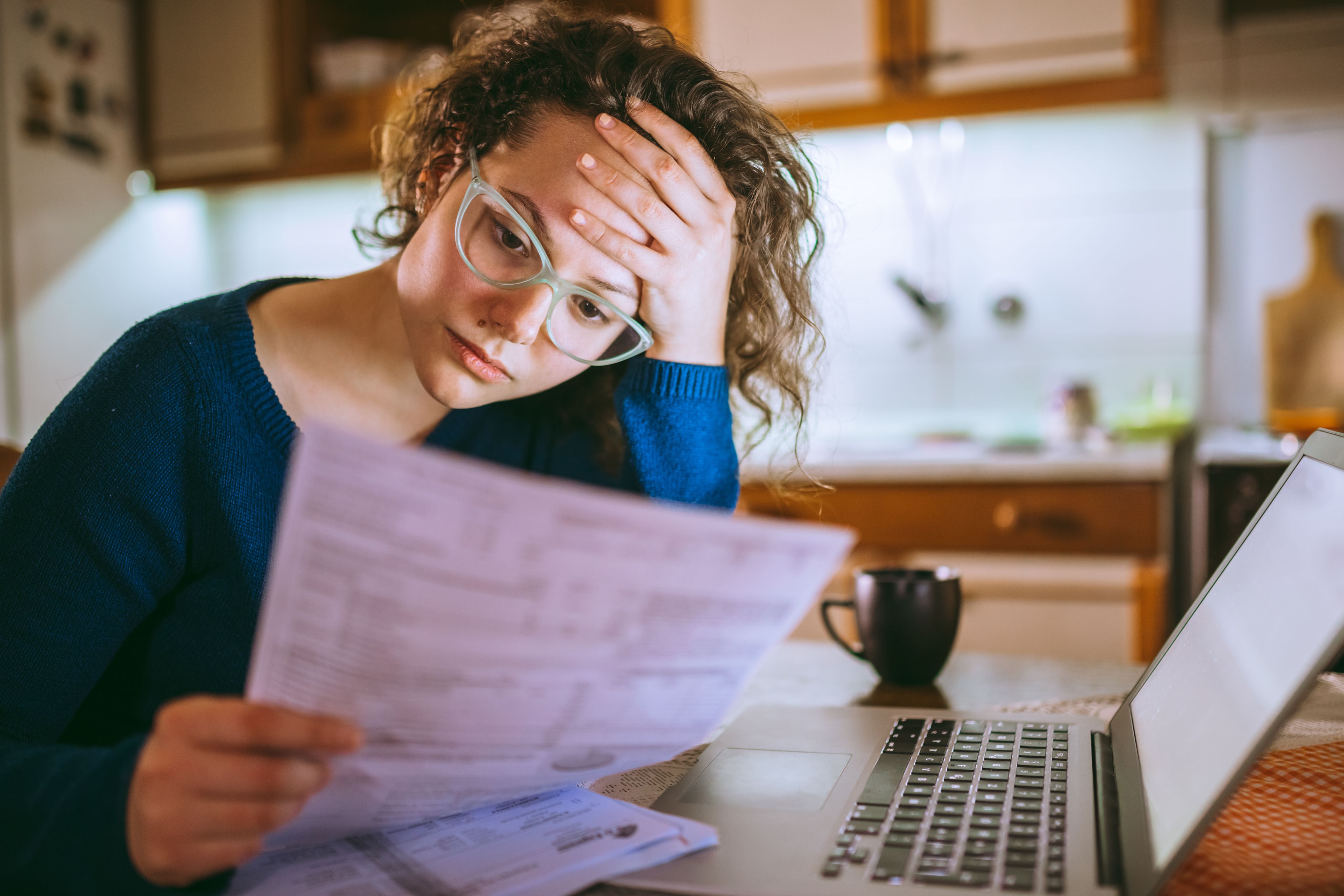 Woman looking stressed with her laptop