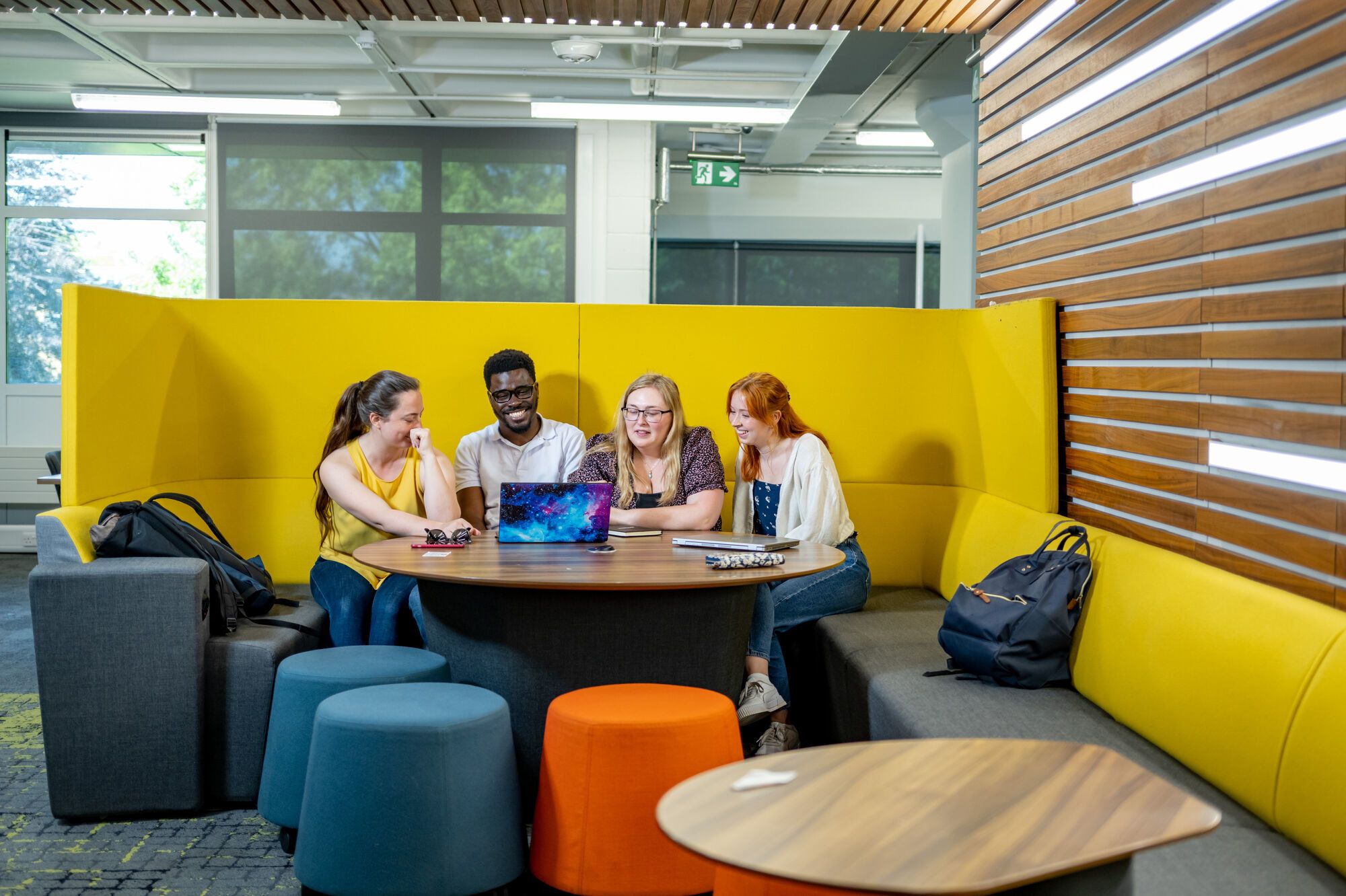 Four students study together in the library