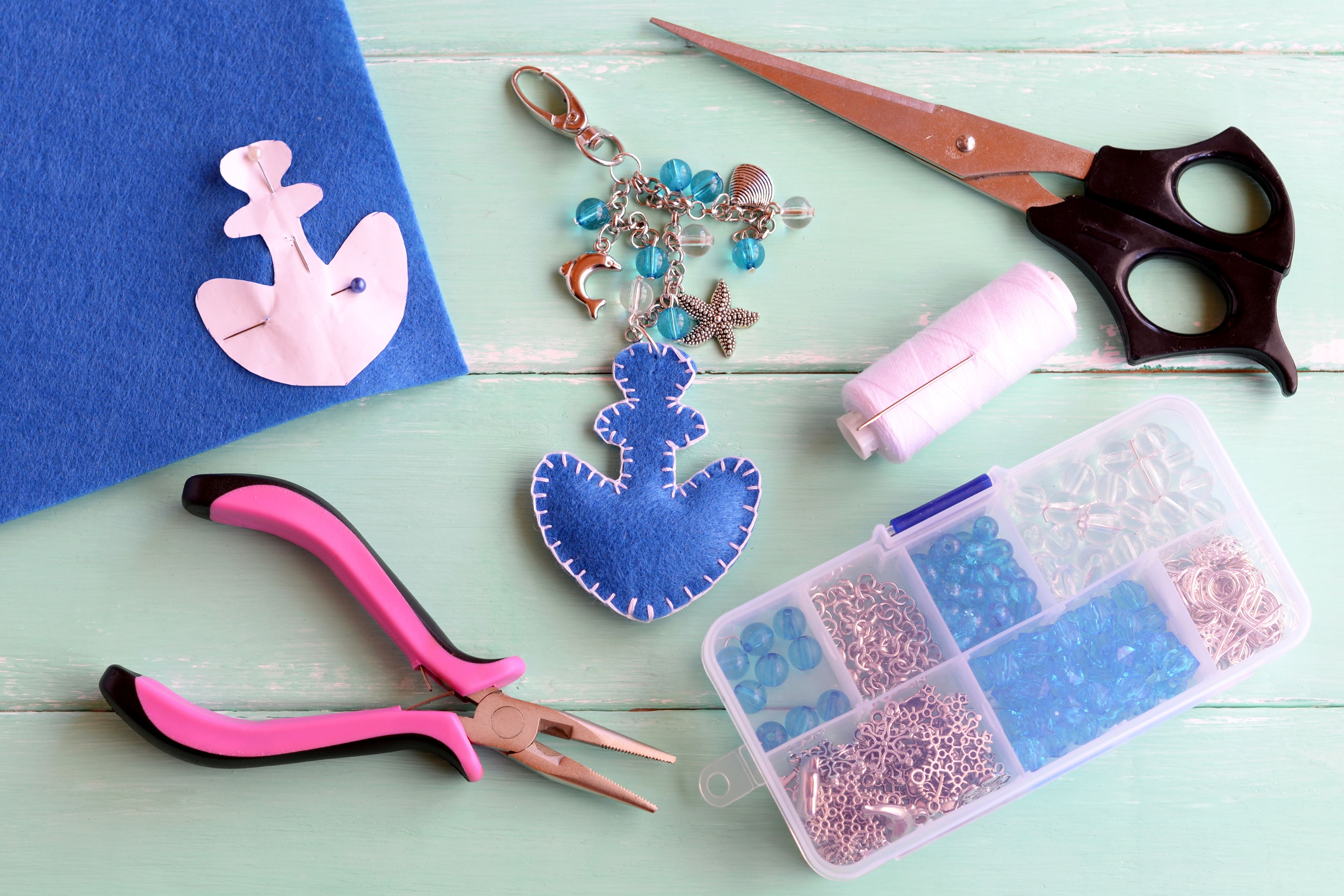 Making a keyring with beads, scissors and other tools 