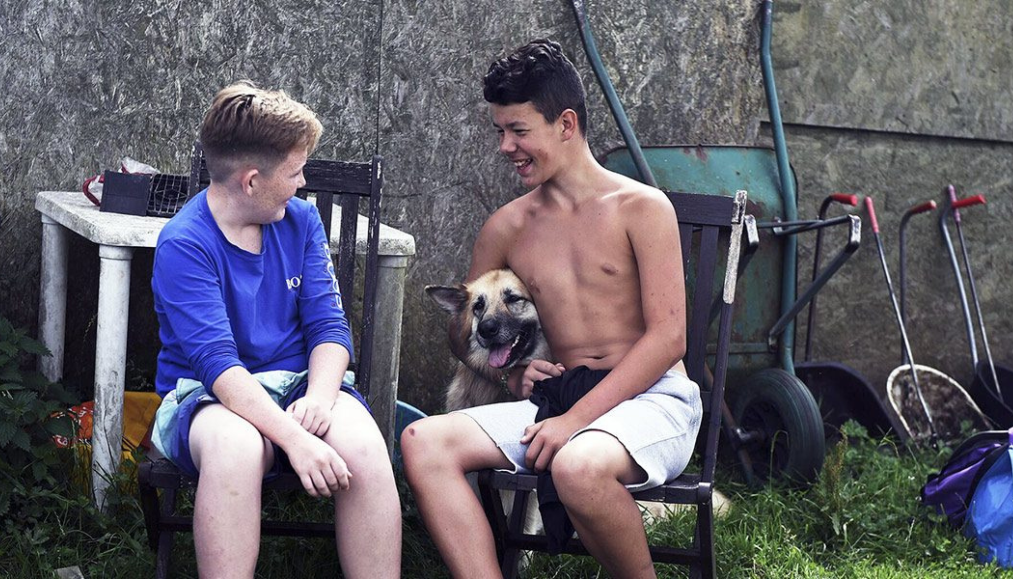 Two young boys with a dog