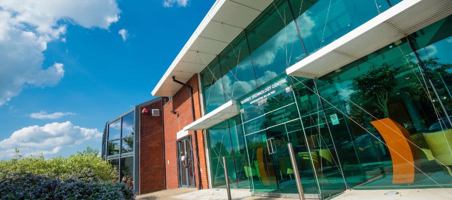 The glass front entrance of Surrey Technology Centre, part of Surrey Research Park