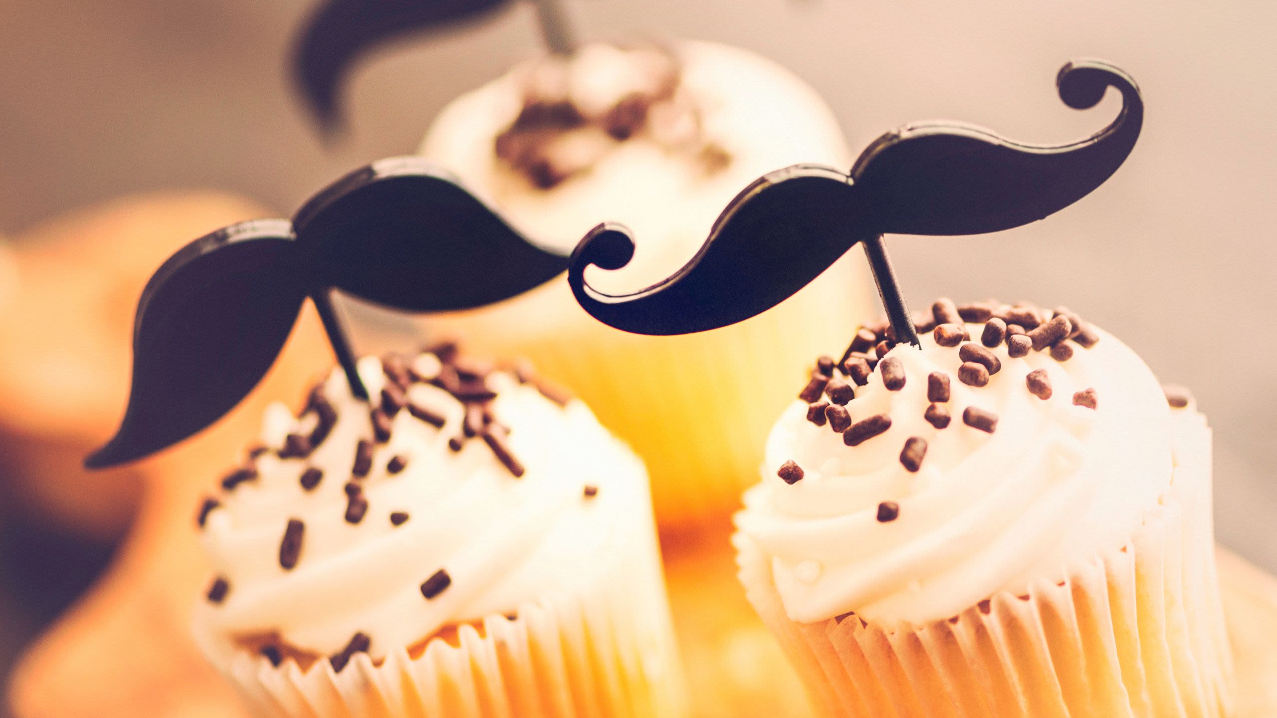 Cupcakes with moustache toppers