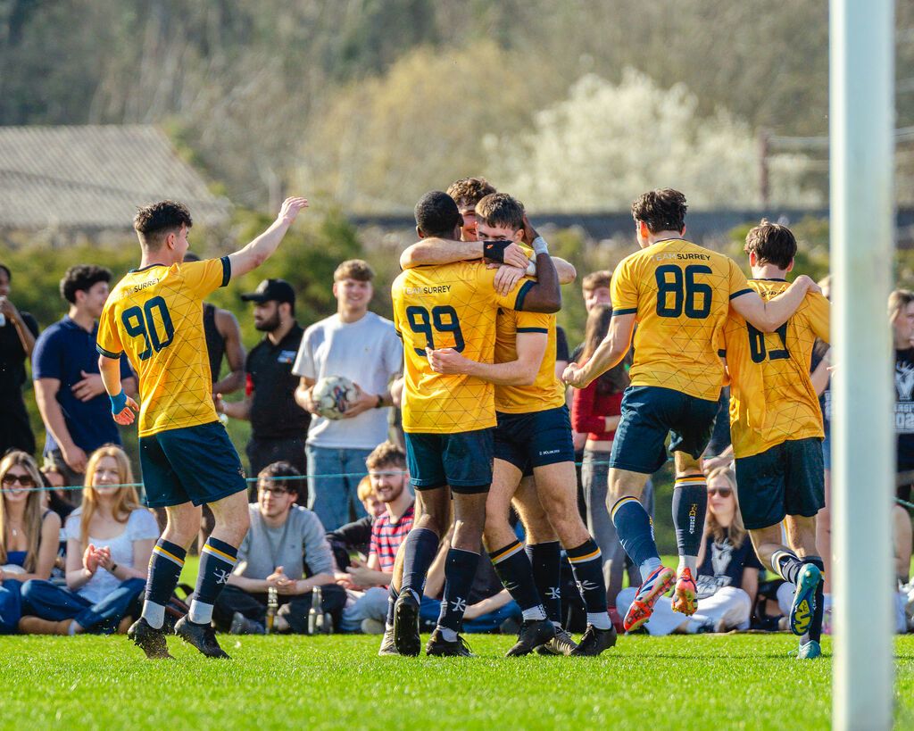 University of Surrey men's football team celebrate scoring a goal at Varsity 2025