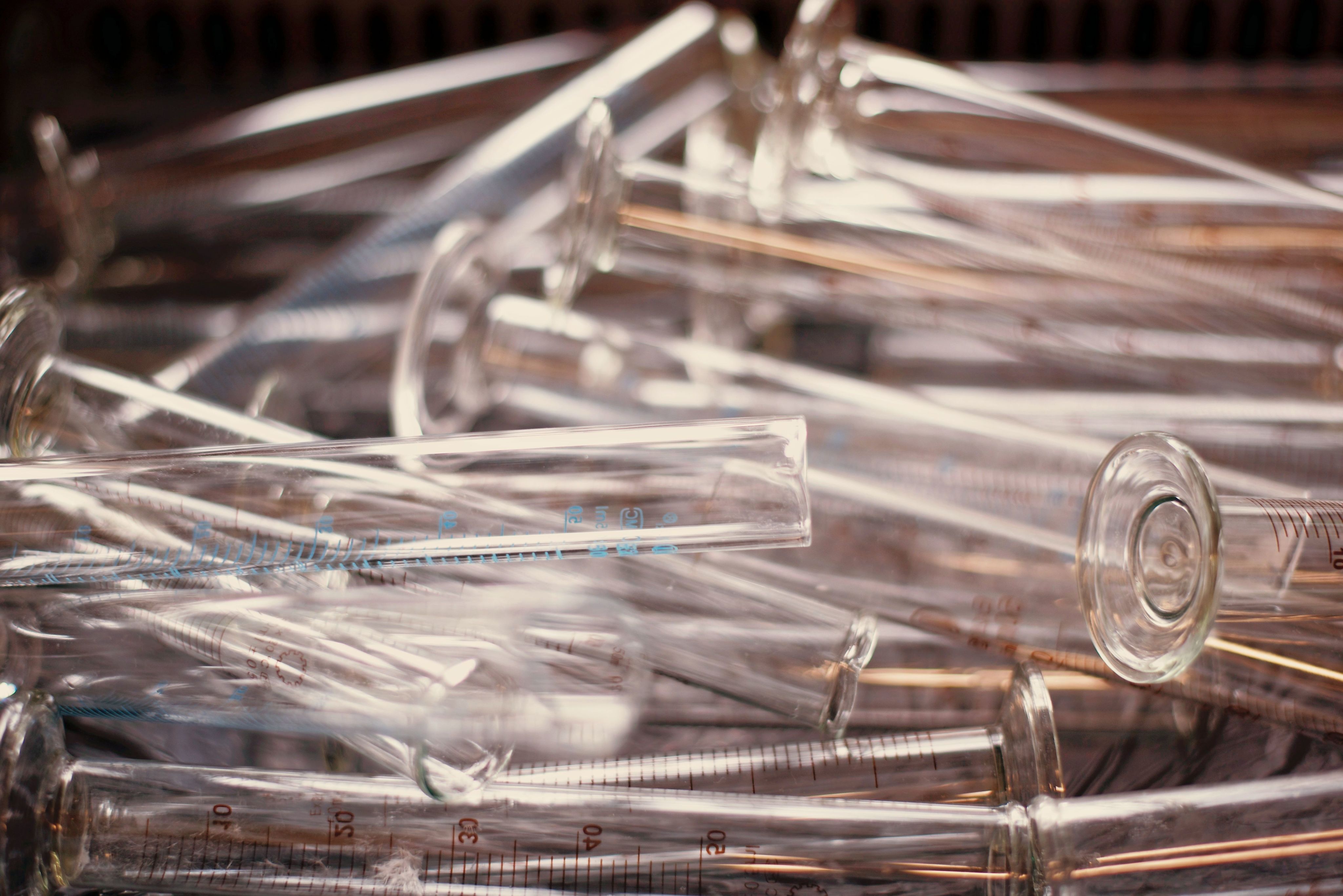 pile of clear measuring test tubes