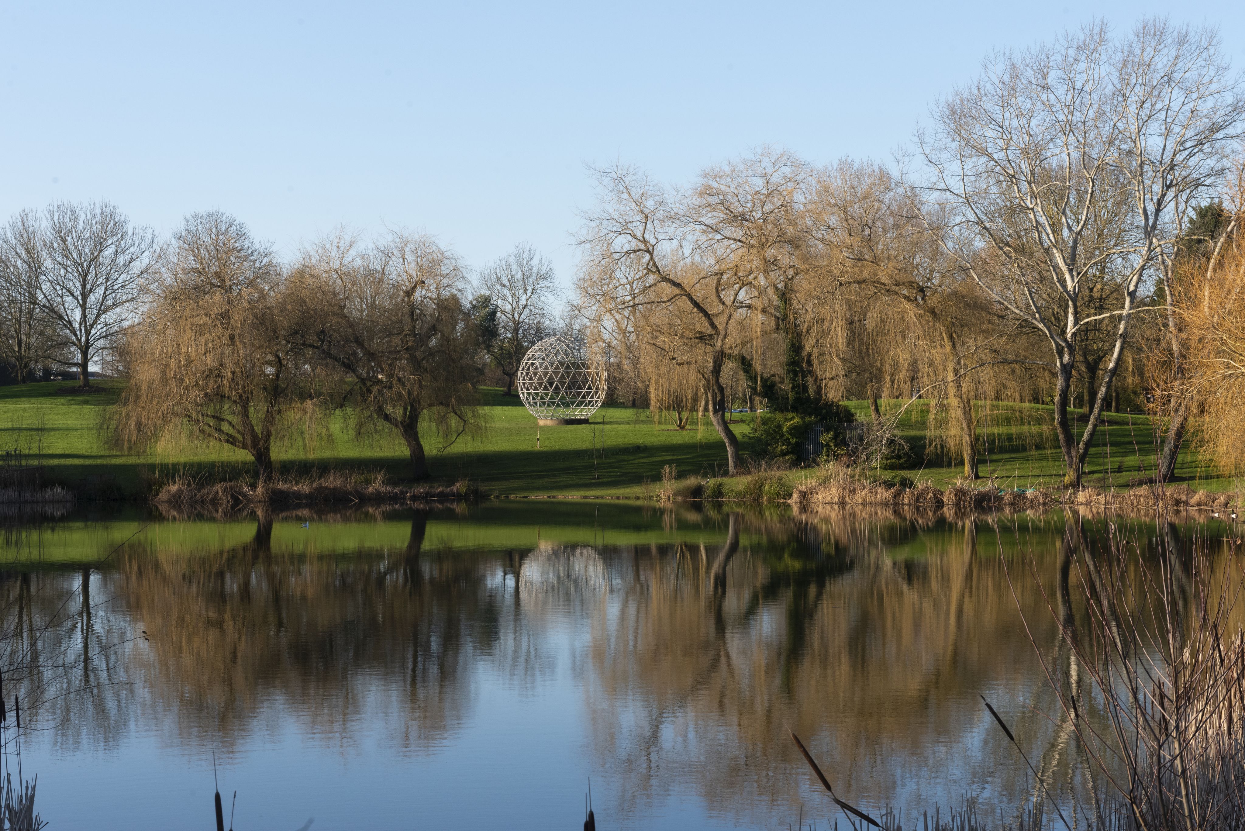 View of the geodesic dome across the lake on Stag Hill campus