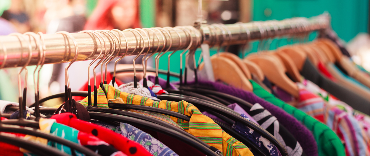 Colourful clothes hanging on a rail