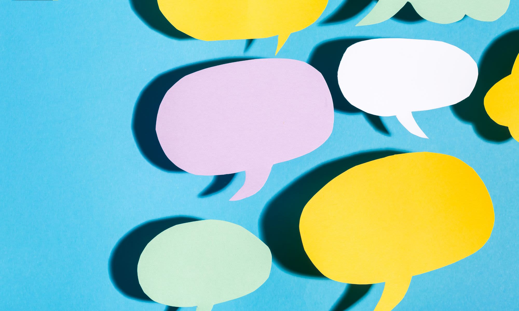 Colourful speech bubbles on a blue background