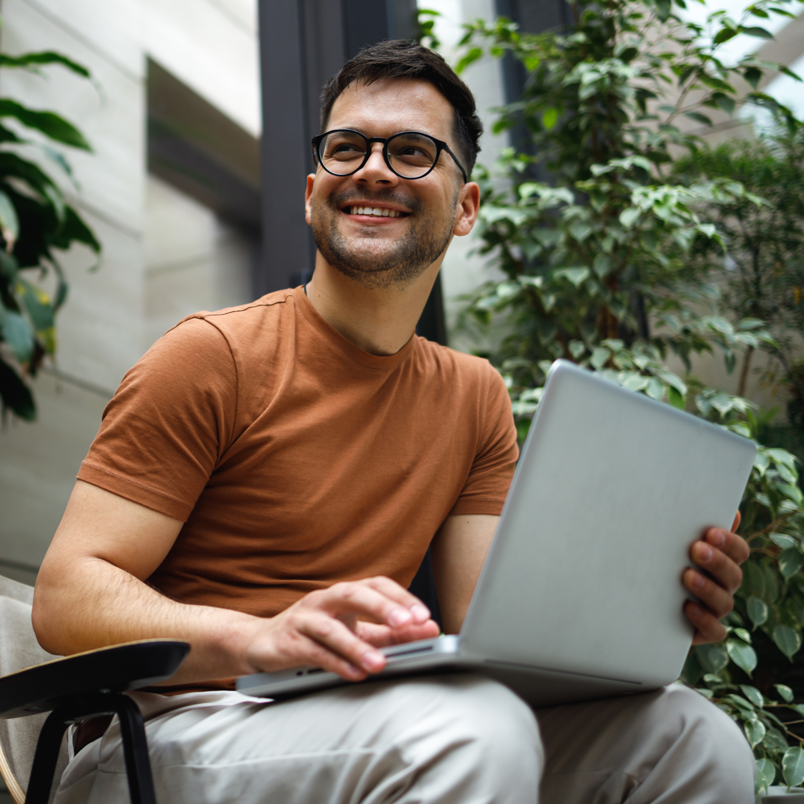 Male student with a laptop