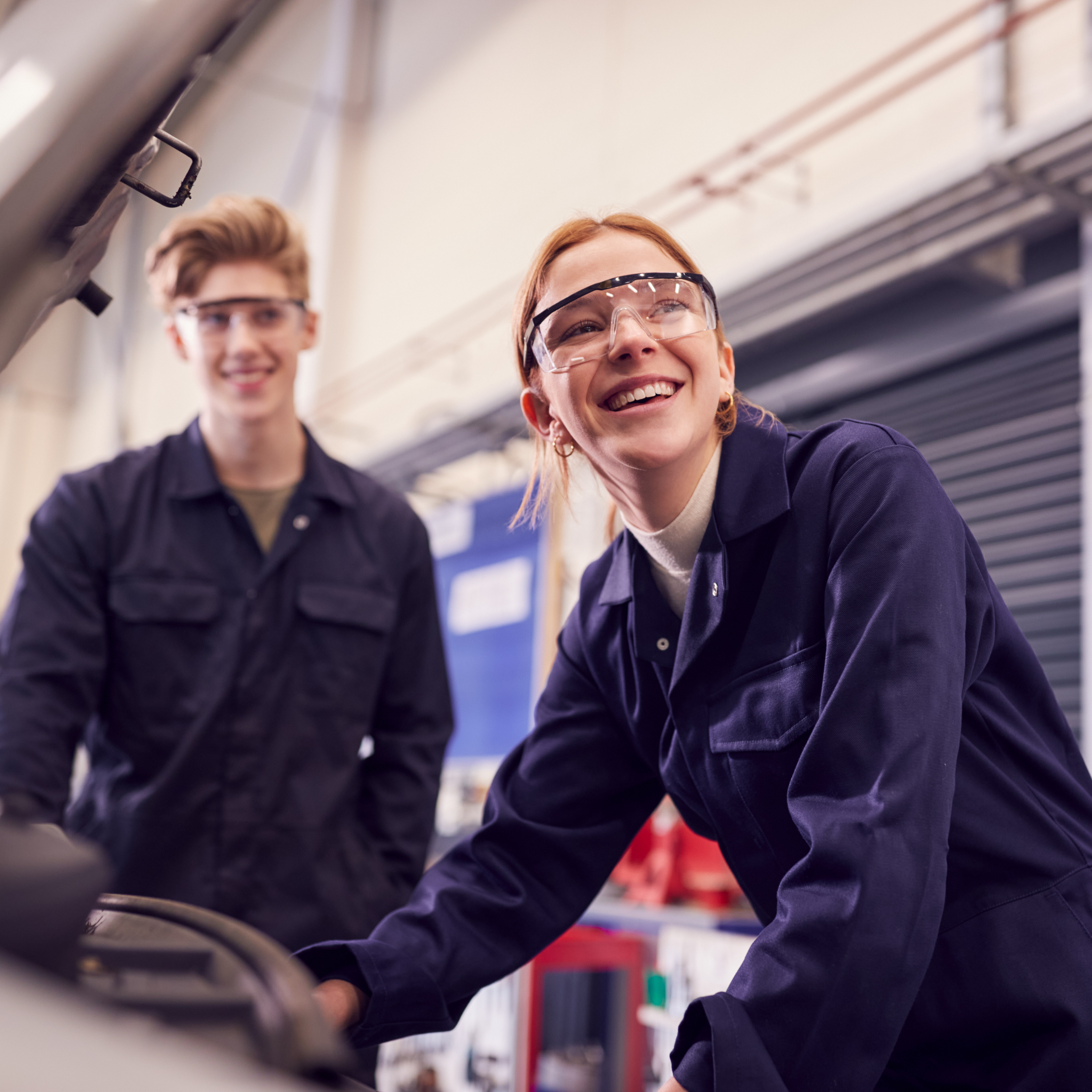 Two young people working as mechanics