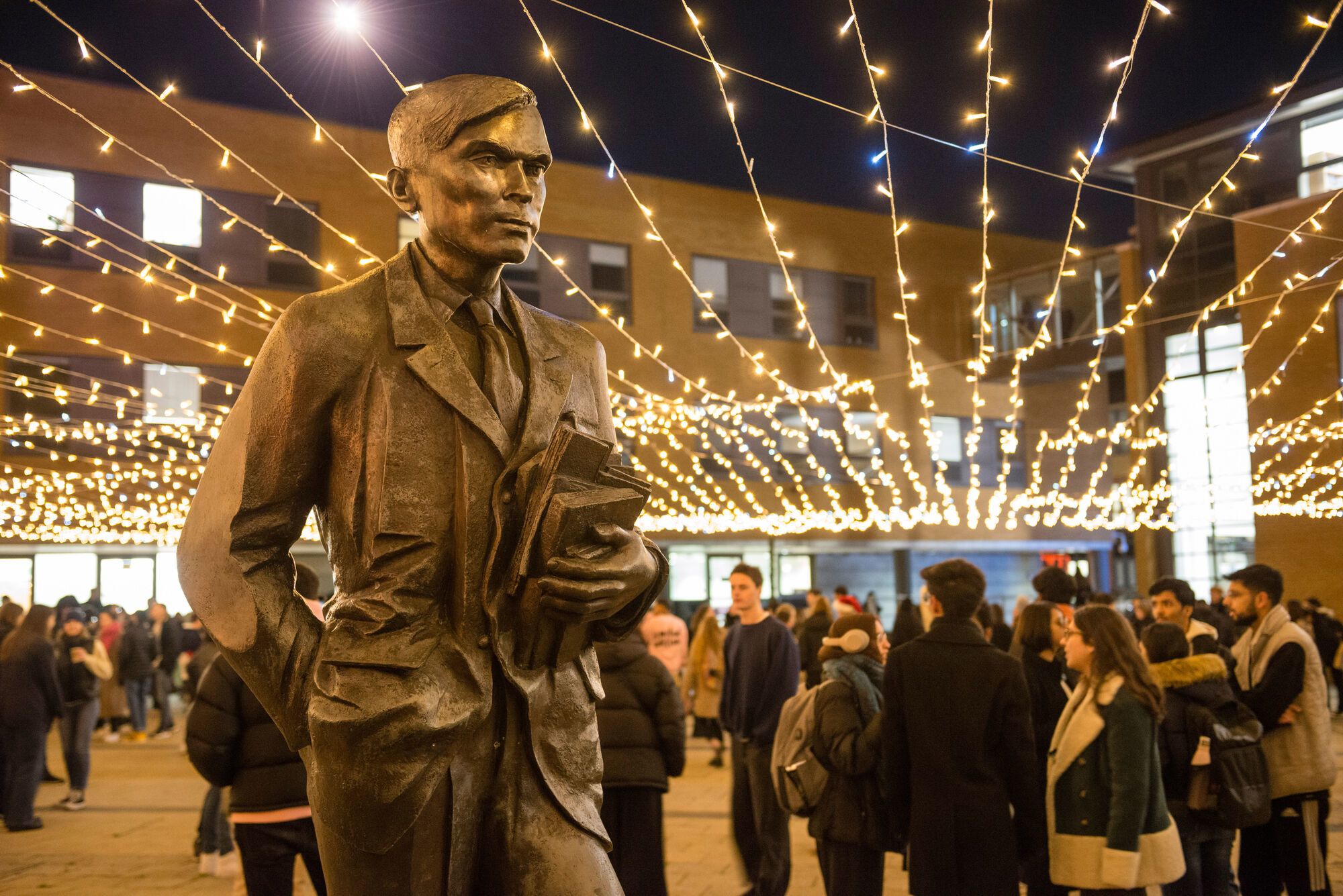 The Alan Turing statue on AP Piazza surrounded by fairy lights
